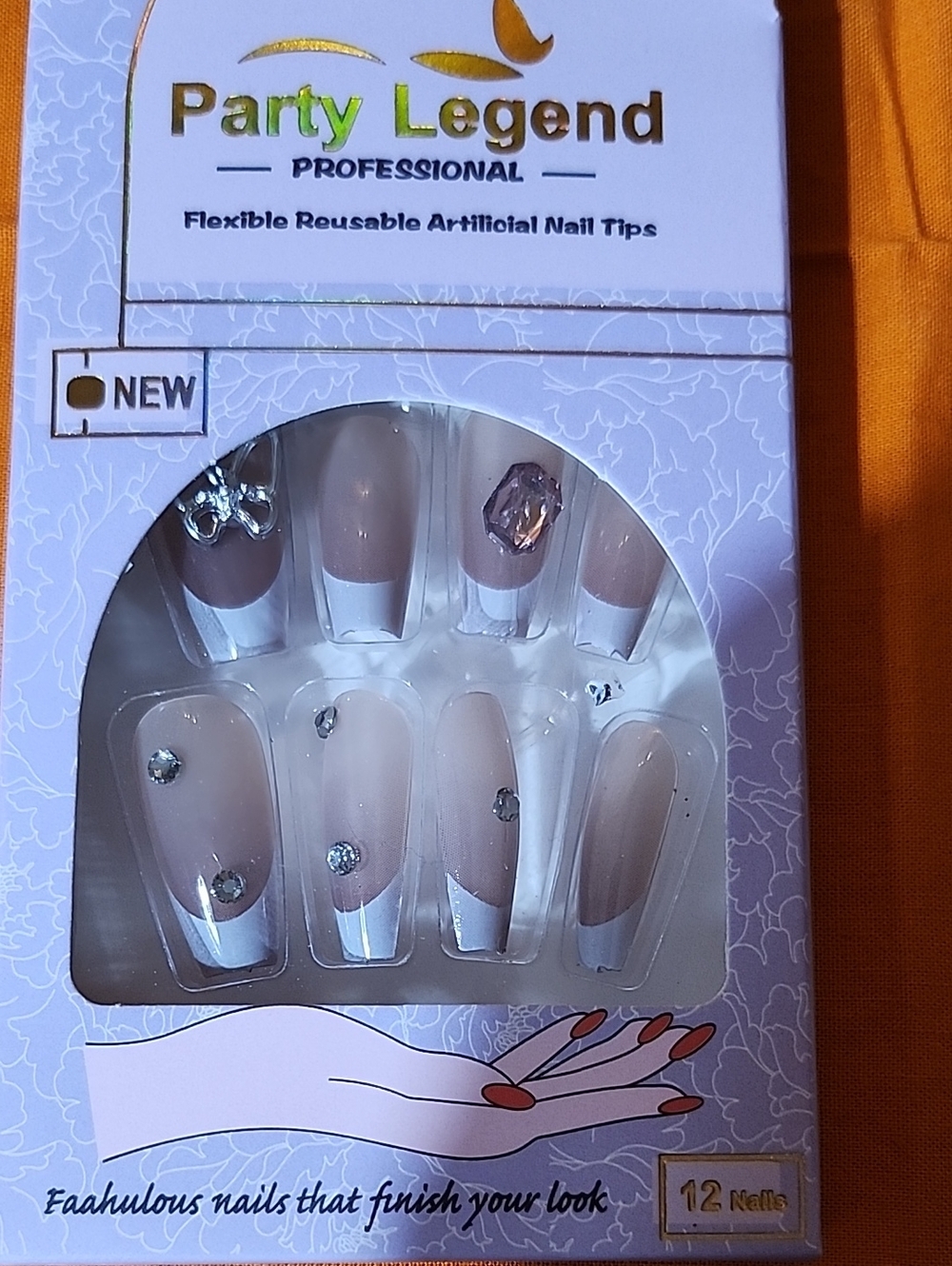 Party legend professional nails.  Neutral with white tip and gems